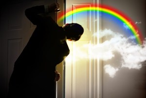 young businessman opening door